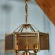 Brass pendant lamp and five-faceted vintage smoked glasses