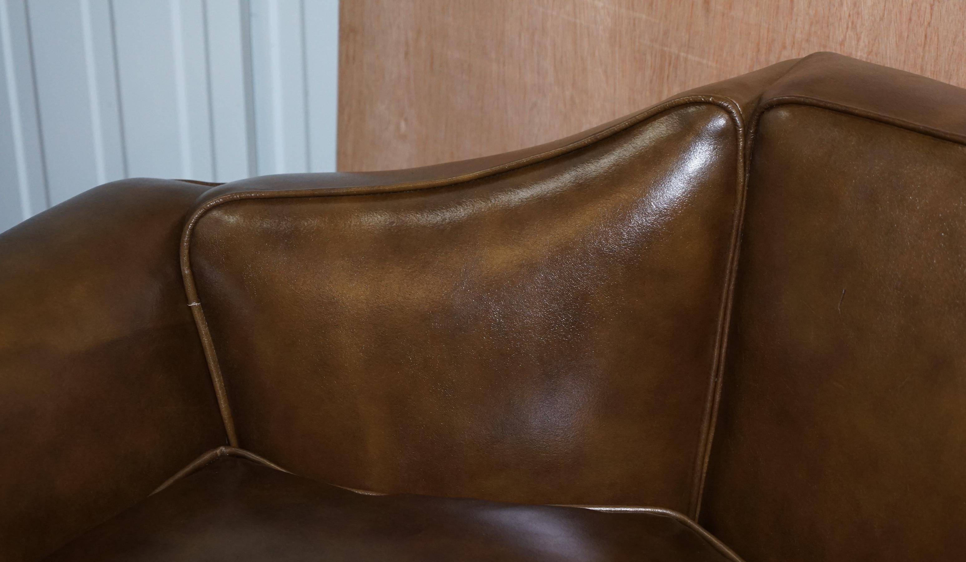 Restored Regency canapé in leather with sculpted Hermès frame.