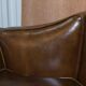 Restored Regency canapé in leather with sculpted Hermès frame.