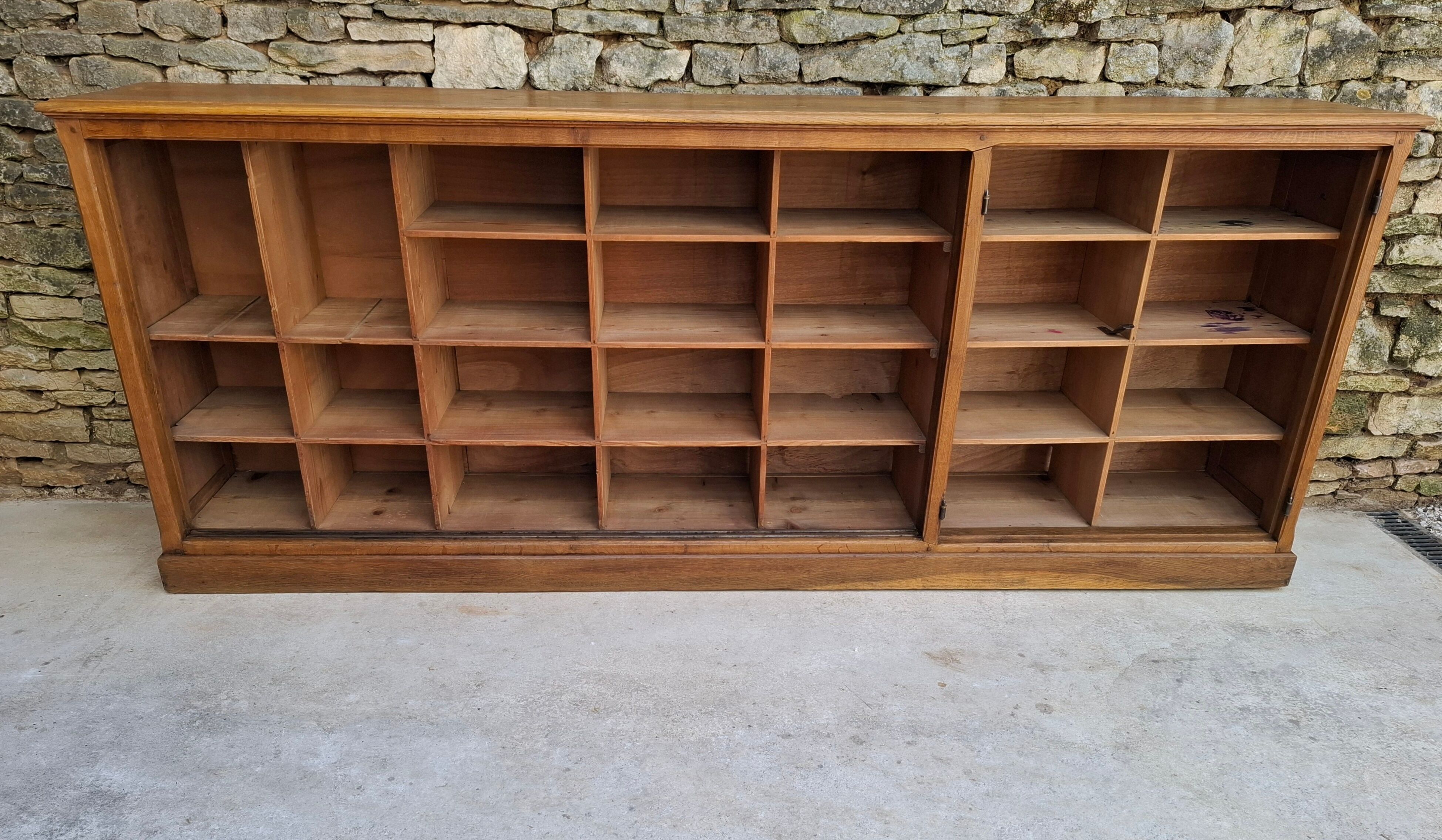 Oak workshop furniture with sliding doors.