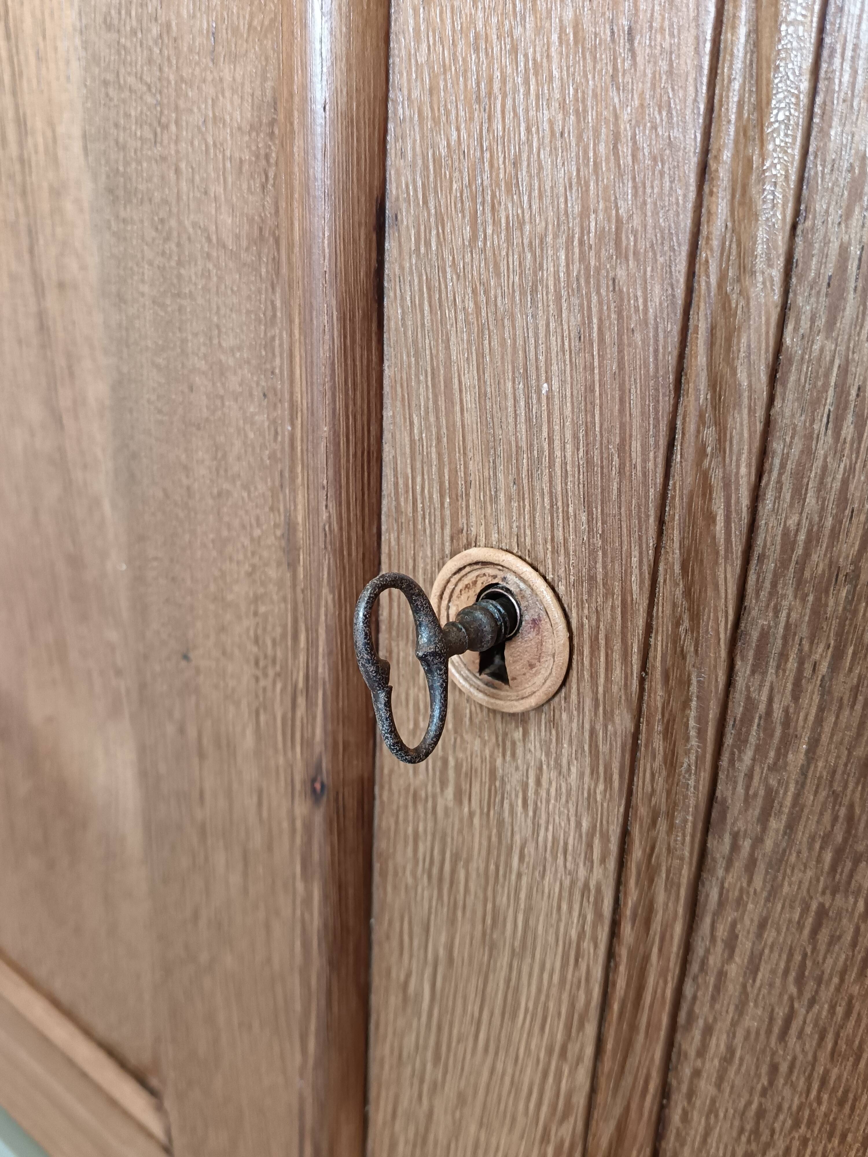 Buffet made of natural wood and bronze green.