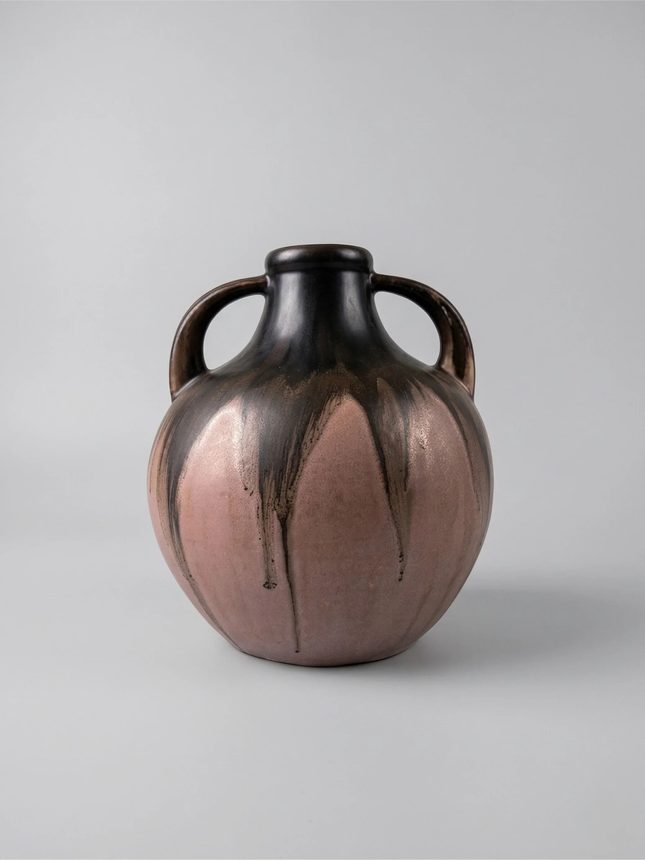 Stoneware vase signed Méténier, double handle, flamed pink and black glaze – 22 cm