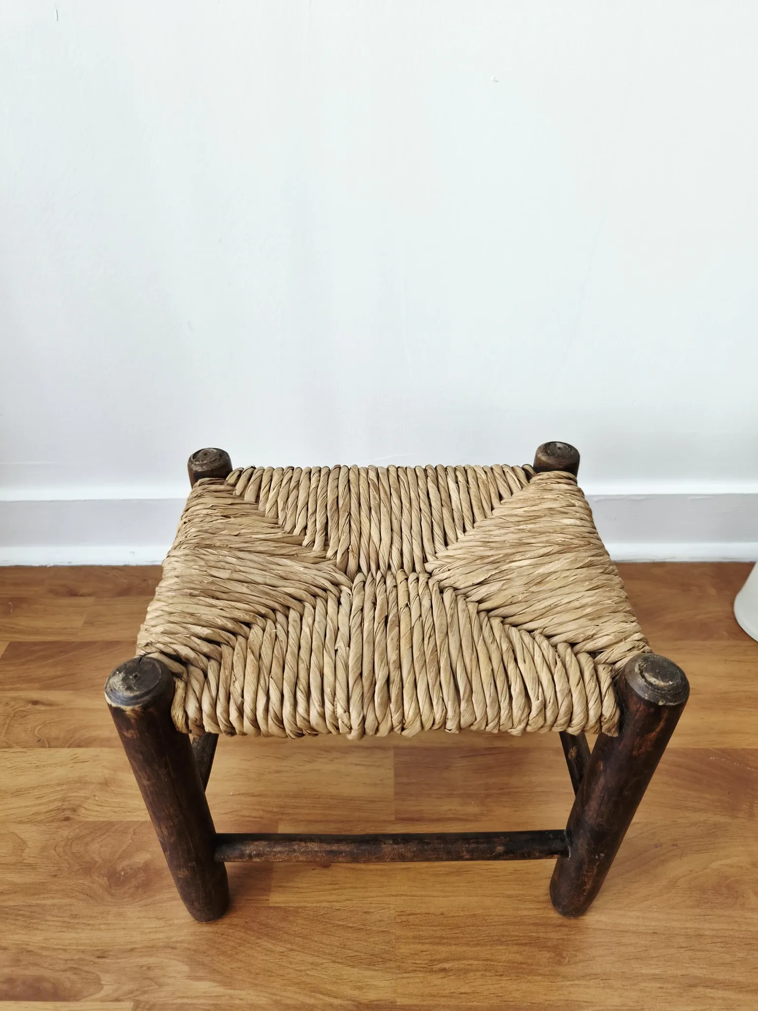 Small rustic vintage wooden and straw stool -