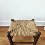 Small rustic vintage wooden and straw stool -