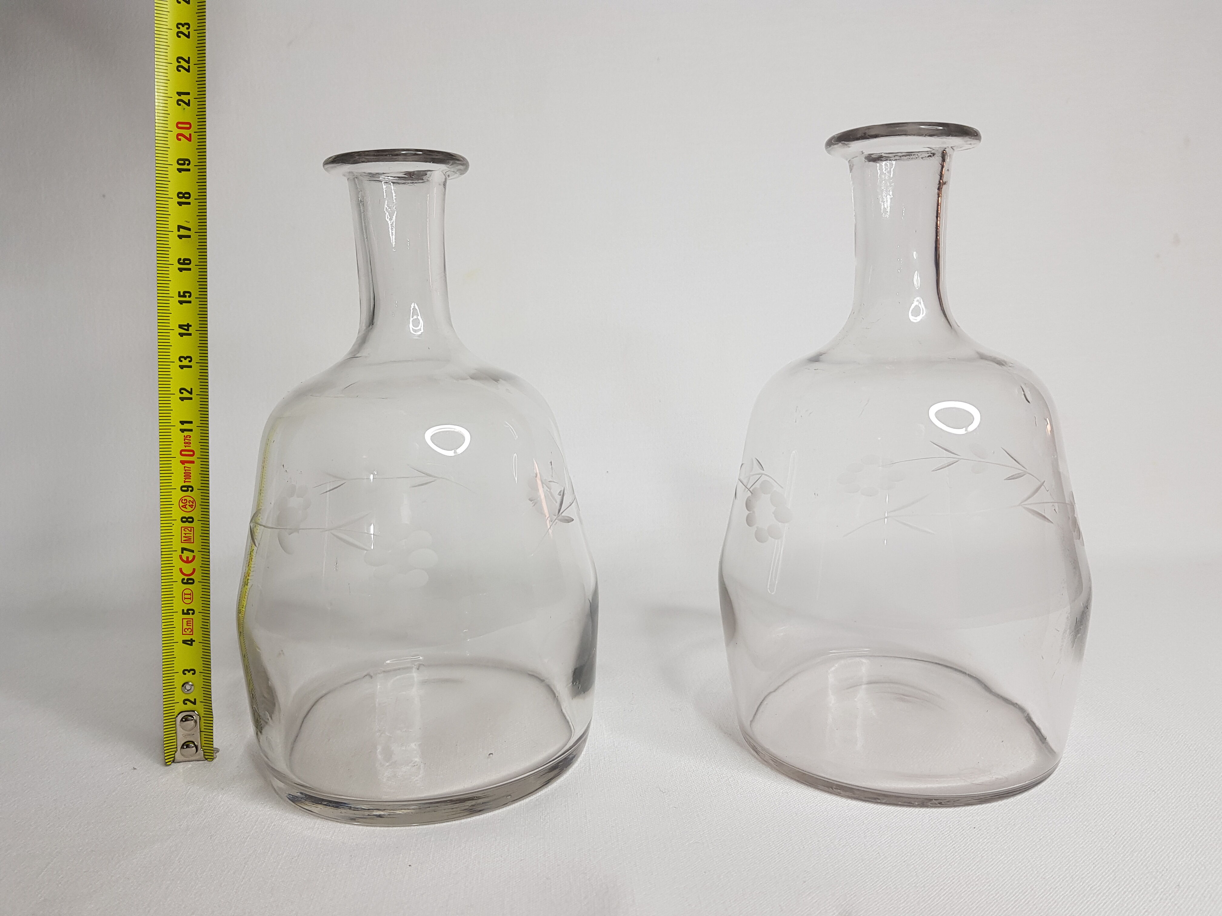 Pair of blown glass decanters and cut with flowers