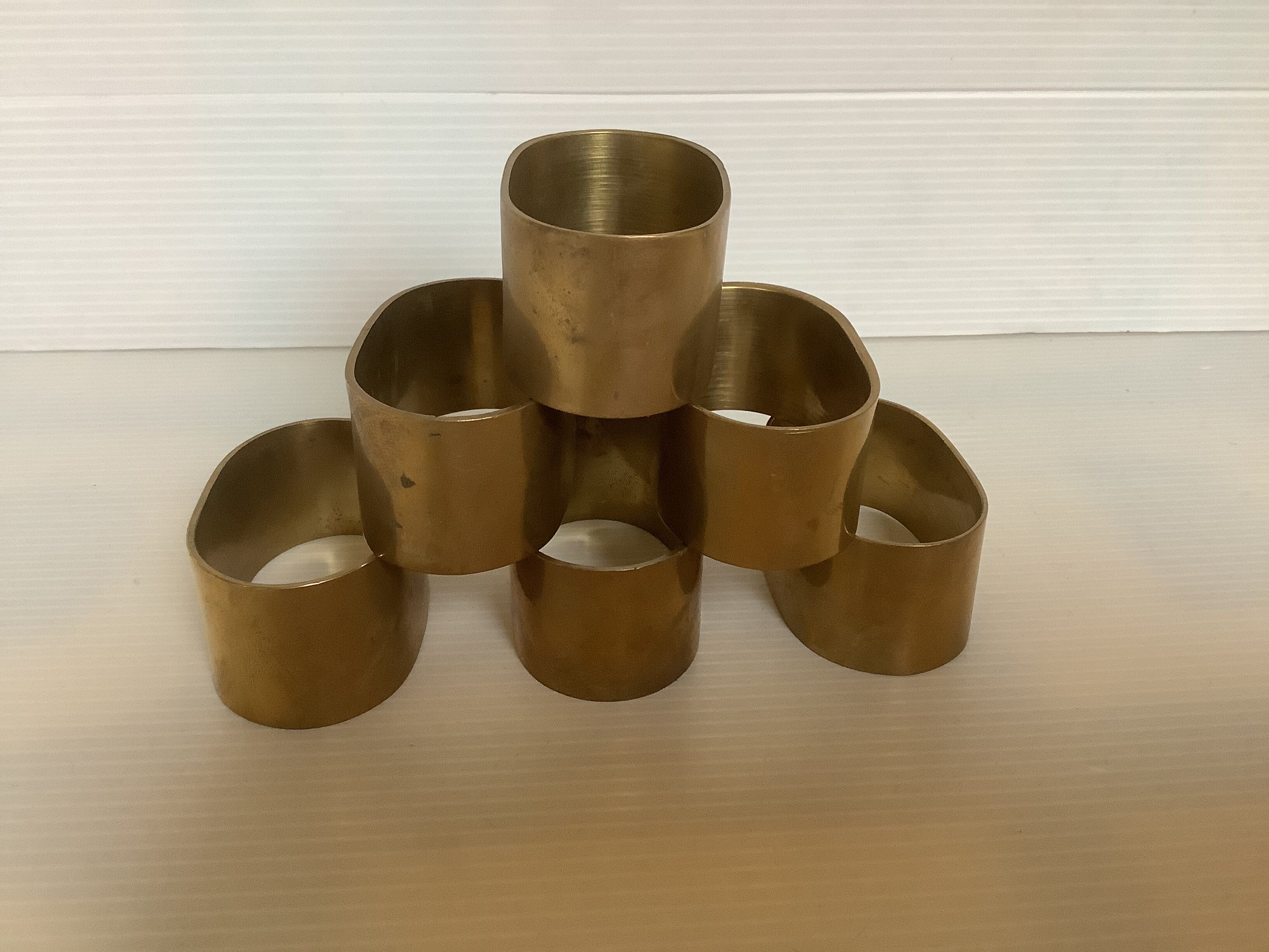 Six old brass napkin rings