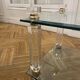 Glass side table with gold decorations.