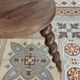 Antique tripod stool made of turned wood.