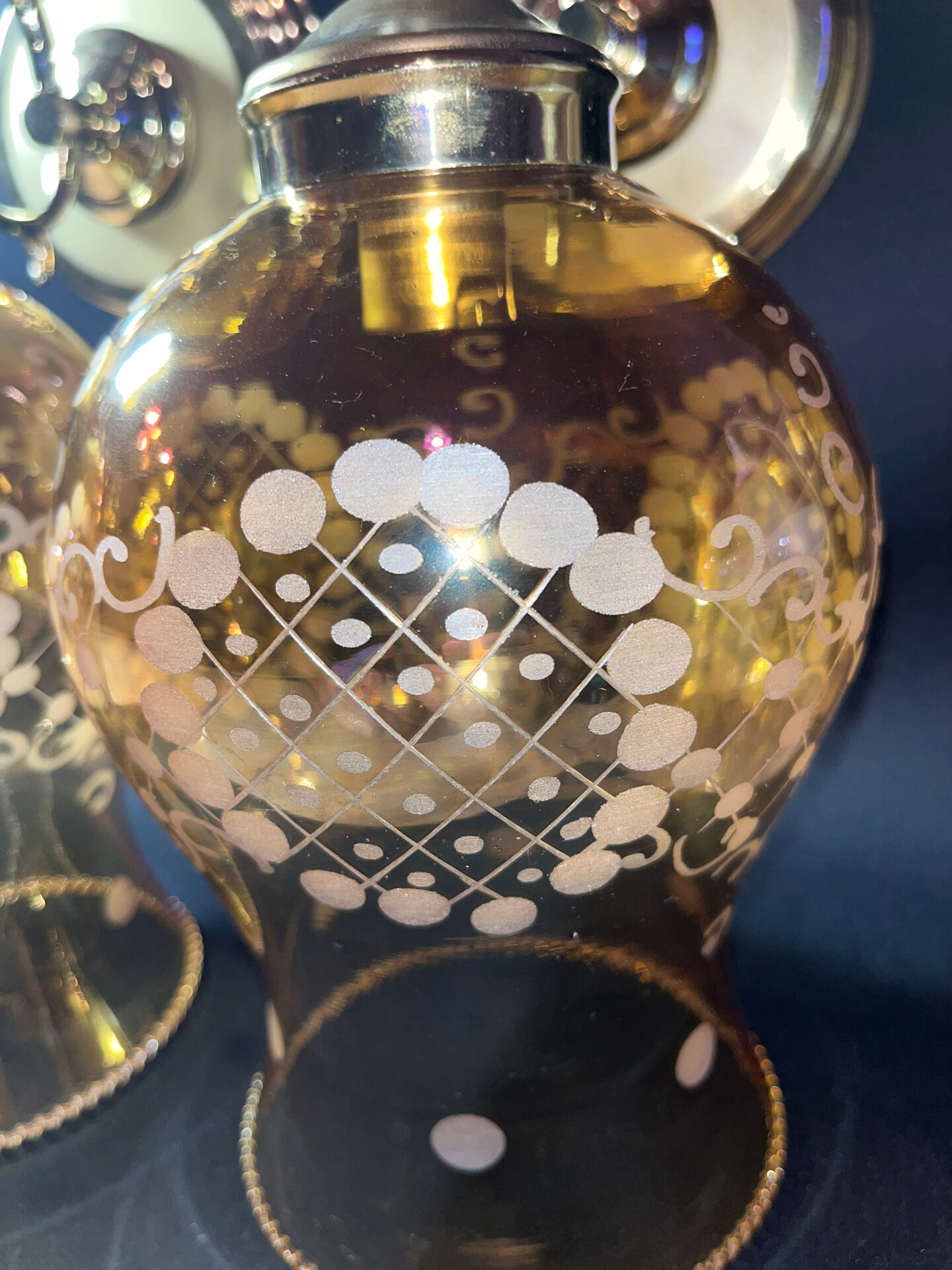 Pair of vintage wall sconces in brass with amber glass globes.
