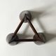 Scandinavian tripod candle holder in carved wood, design from around 1970.