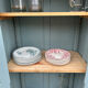 Small antique wardrobe with a faded white patina.