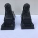Former Egyptian cast-iron chenet in vintage black metal