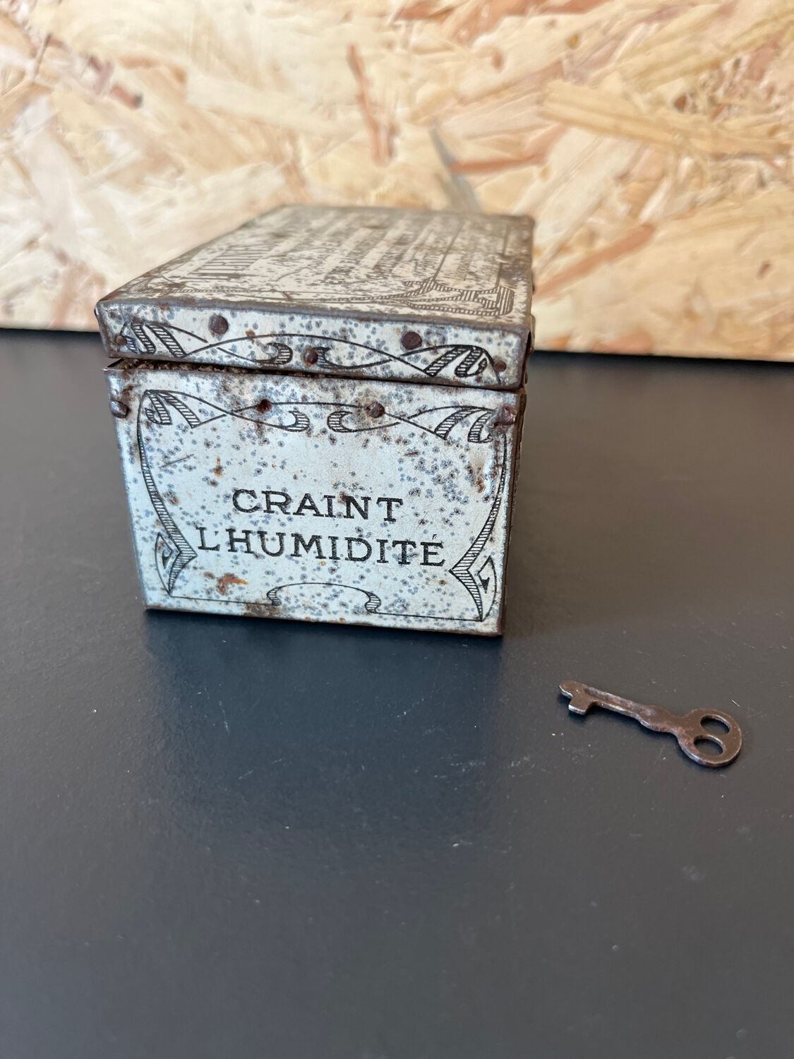 Old metal and wood medicine box with key