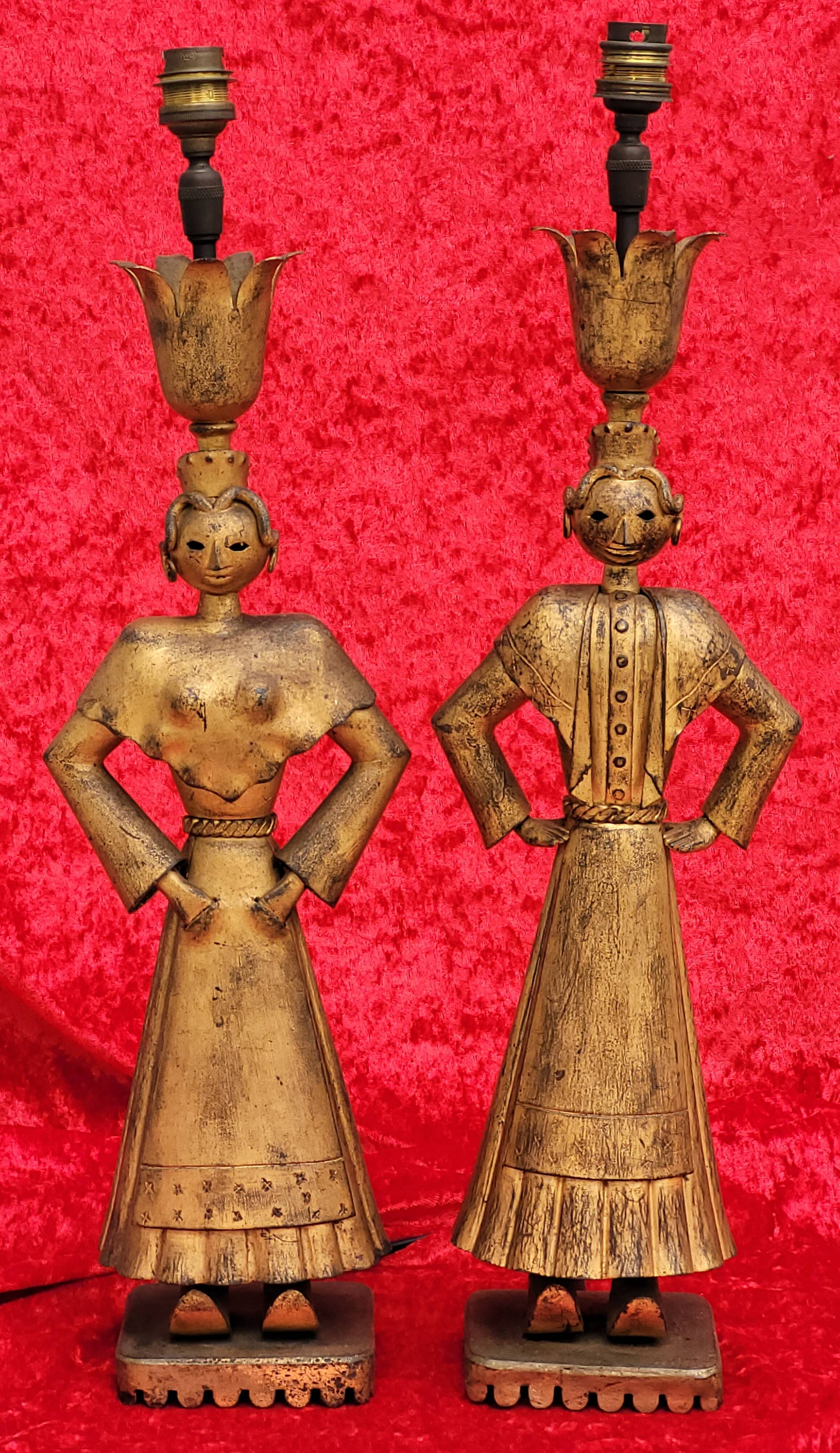 Pair of gilded beaten iron sculpture lamps attributed to Gilbert Poillerat
