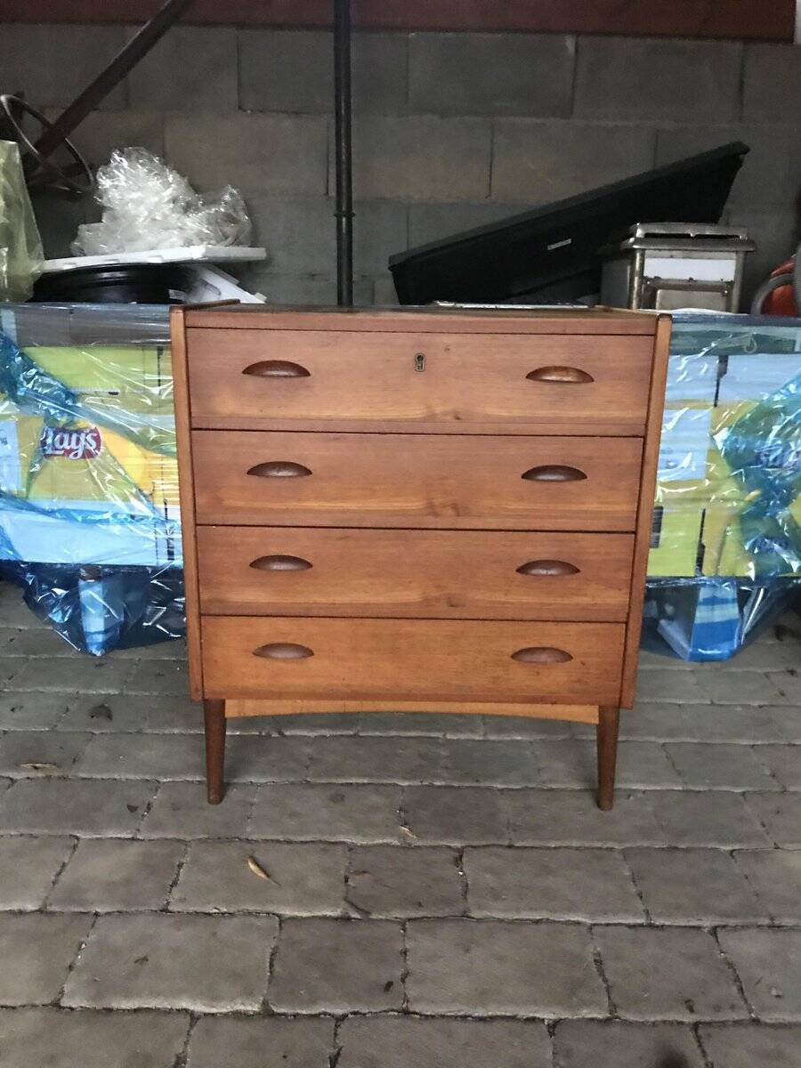 Danish commode from the 1960s in brown teak, with 4 drawers and elegant tapered legs.