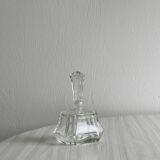 Small transparent faceted glass bottle