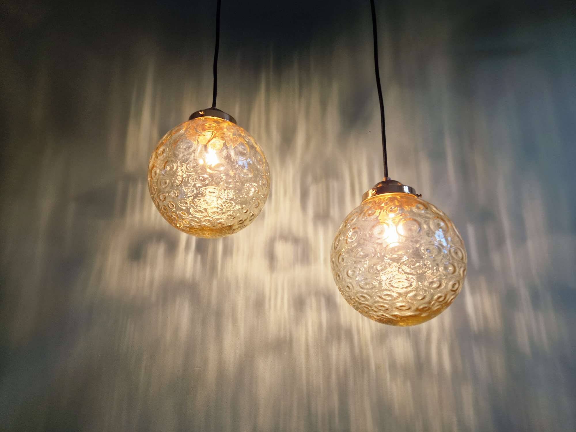 Pair of amber bubble glass pendant lights, 1970s