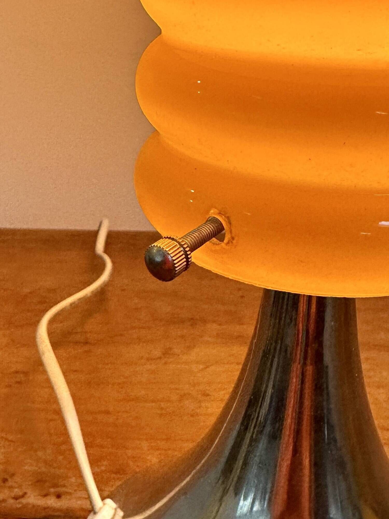 Vintage orange lamp with chrome tulip base and glass shade