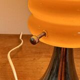 Vintage orange lamp with chrome tulip base and glass shade