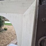 Oval mirror with a distressed white frame