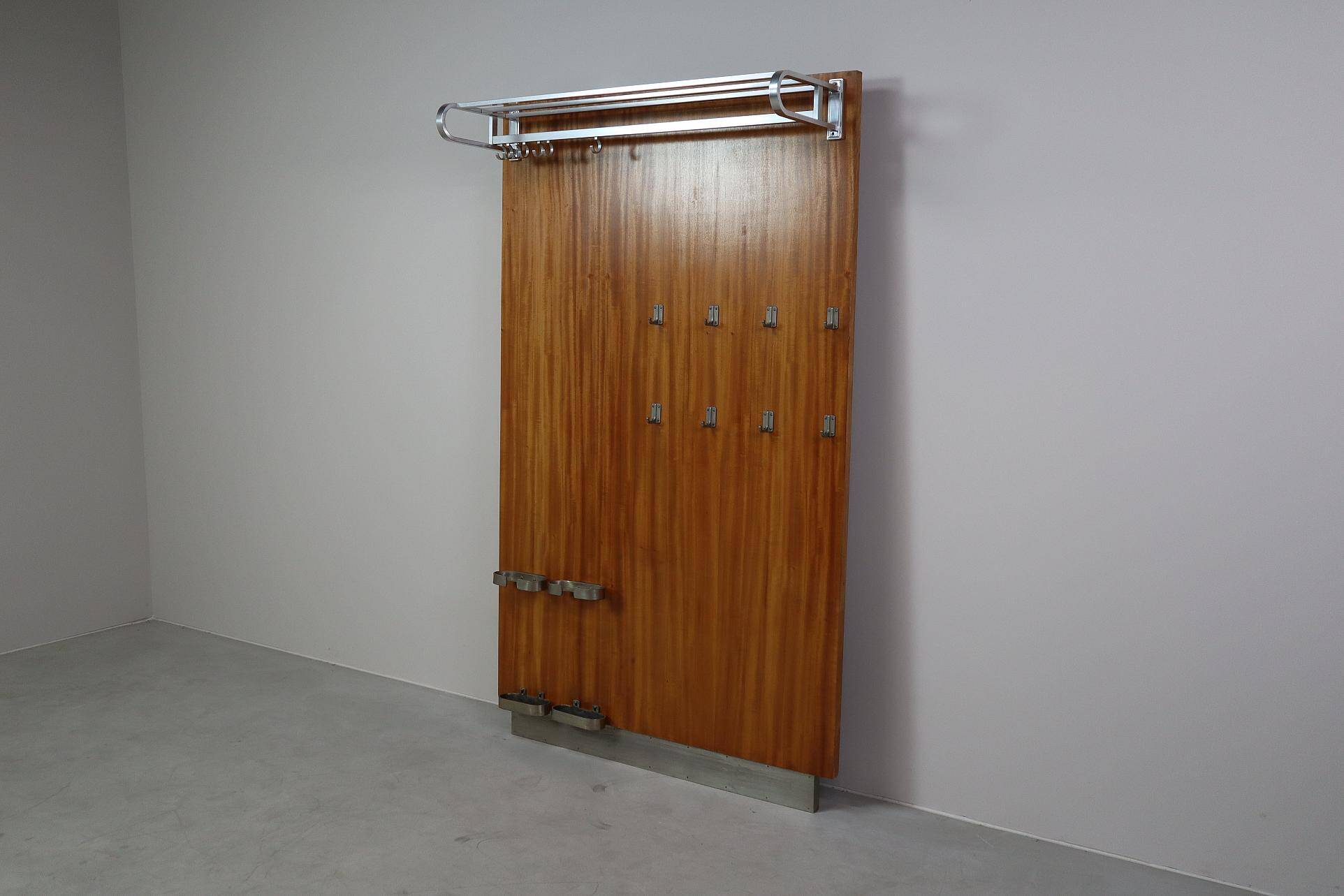 Modernist wall-mounted cloakroom in teak