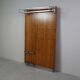 Modernist wall-mounted cloakroom in teak