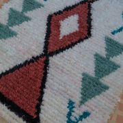 White Moroccan Boucherouite Berber rug with colorful patterns