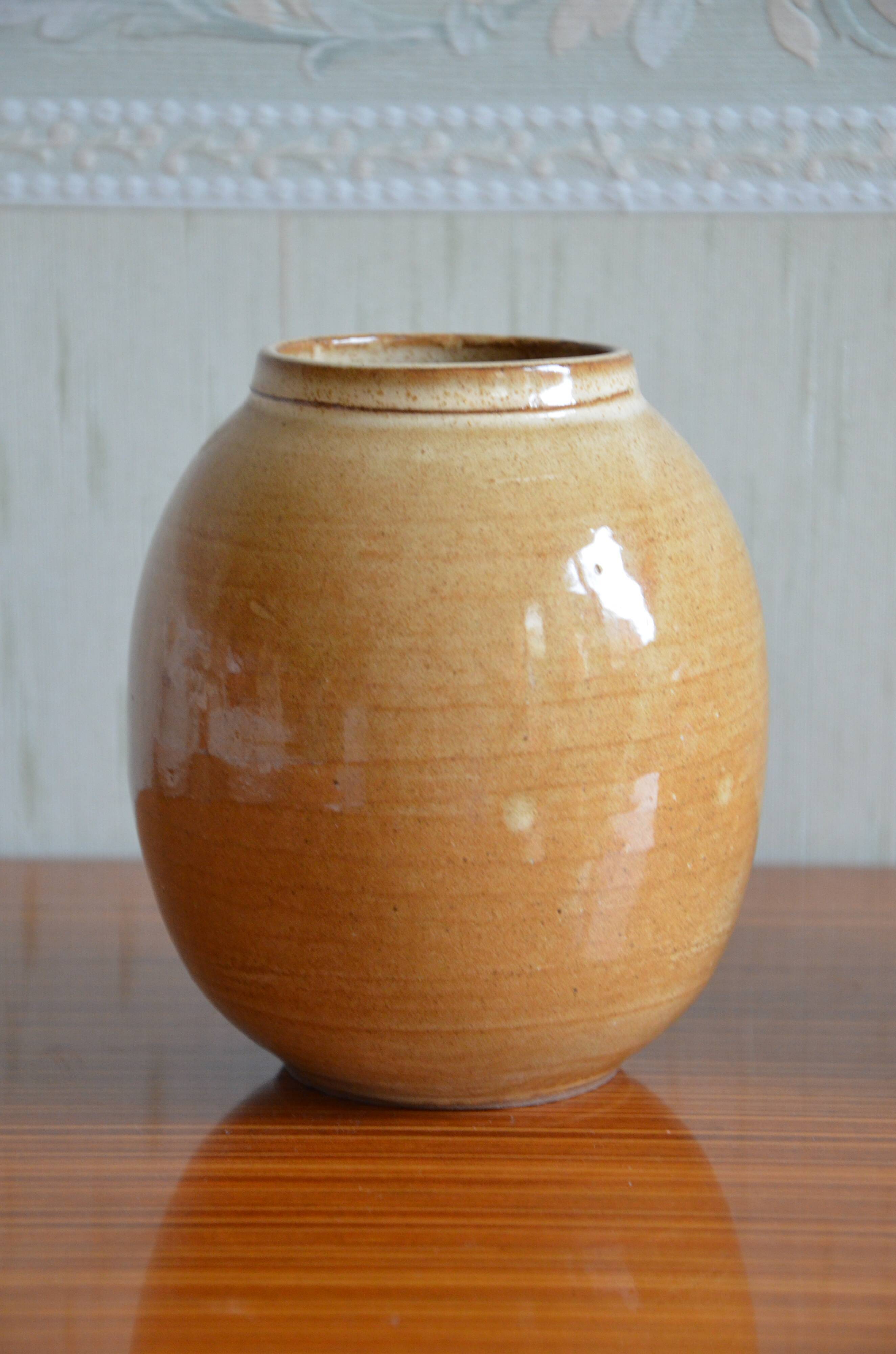 Small varnished sandstone vase