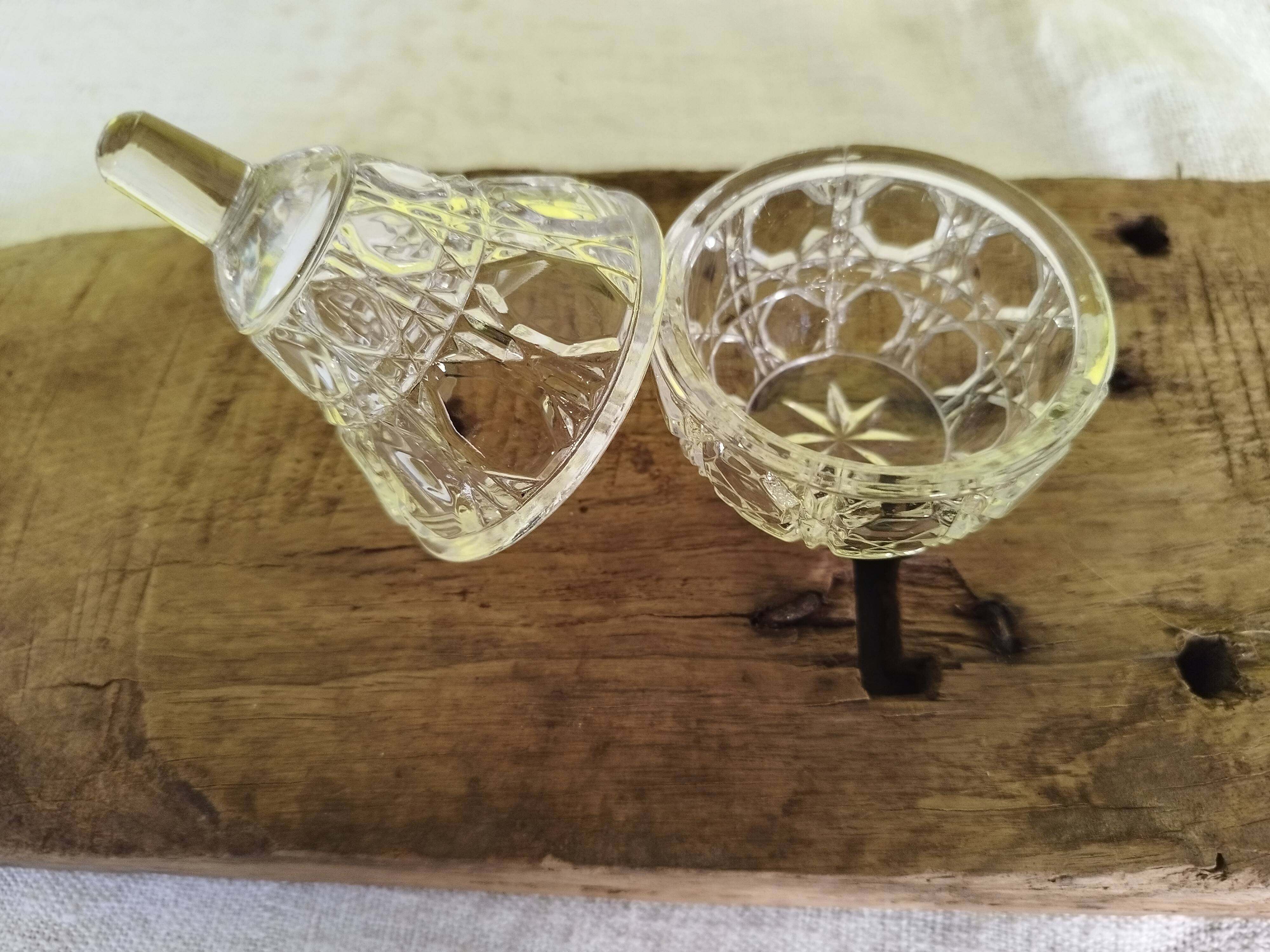 Small pear-shaped chiseled glass jar