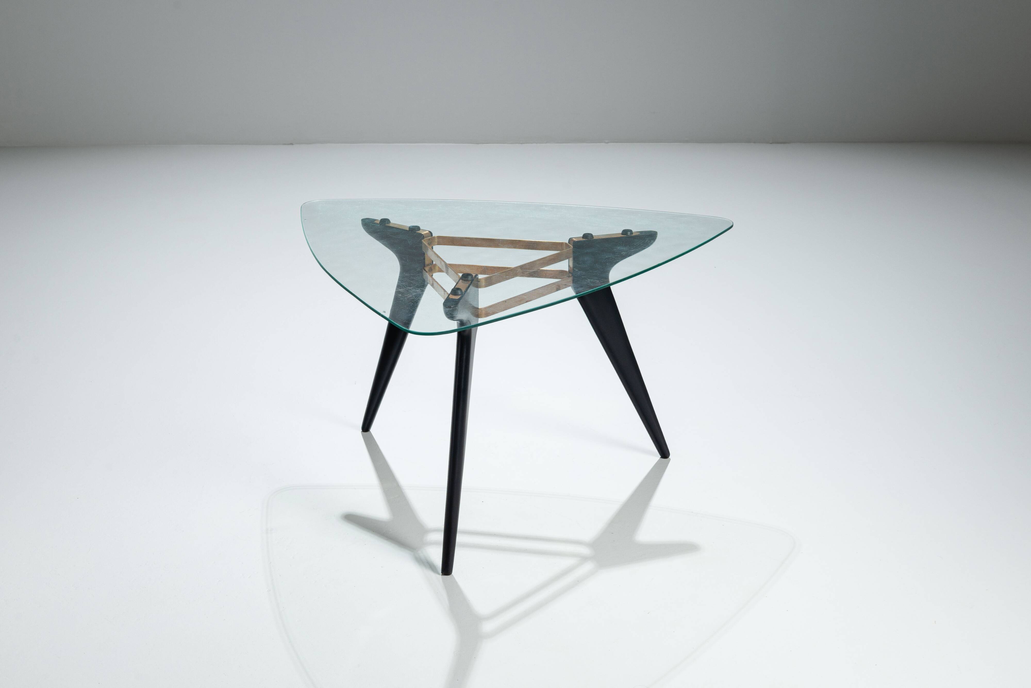 Triangular coffee table in the manner of Alfred Hendrickx