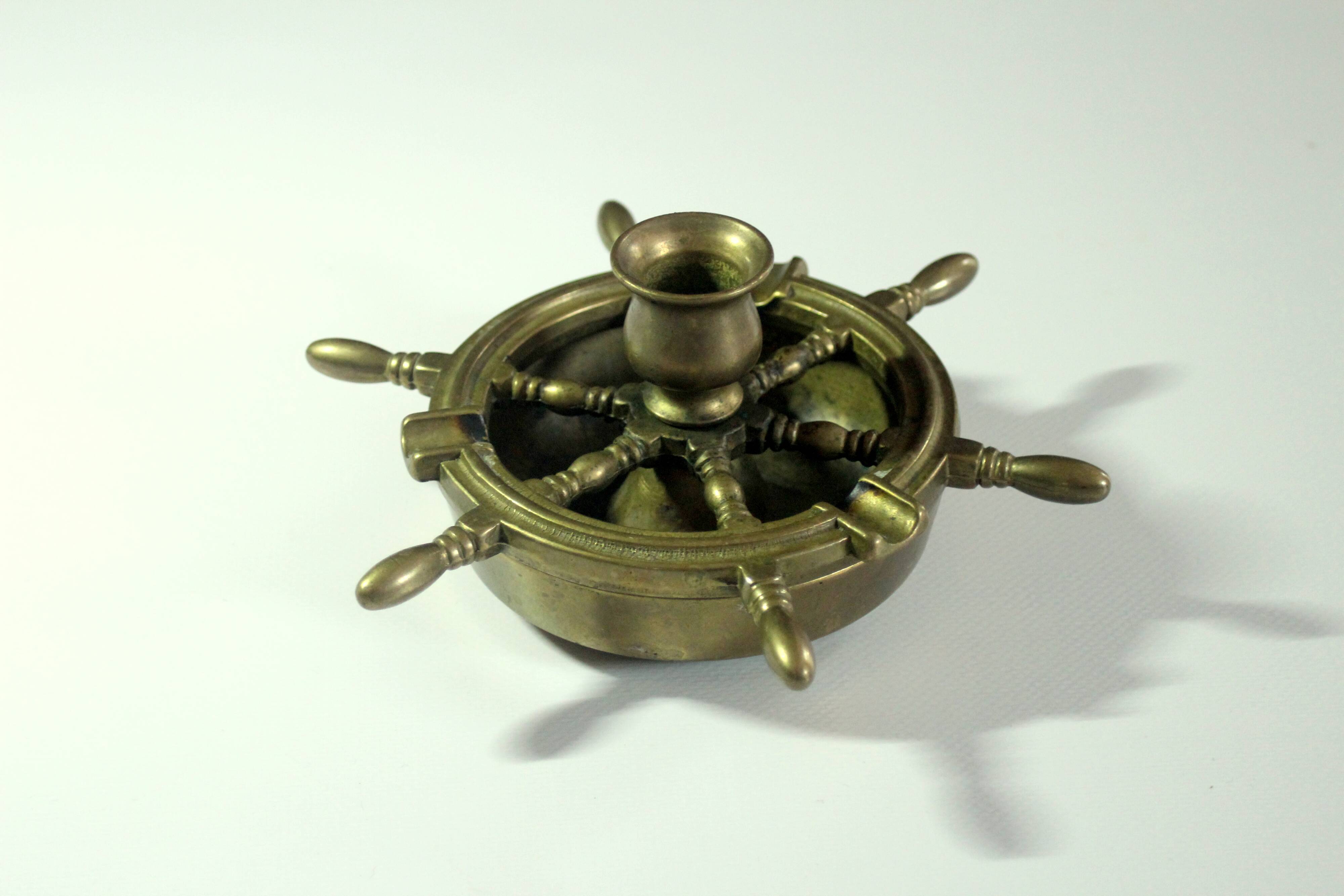 1960s solid brass ashtray in the shape of a steering wheel with a candle stick, vintage