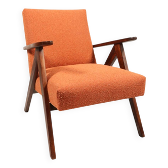 Vintage orange curly armchair Scandinavian design 1970
