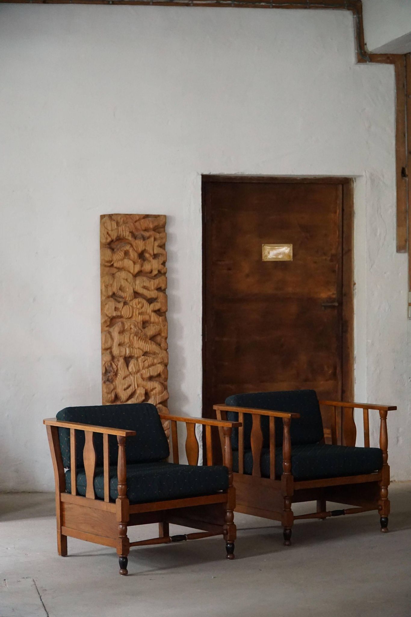 Art Nouveau, pair of oak lounge chairs, reupholstered in style fabric, 1920s.