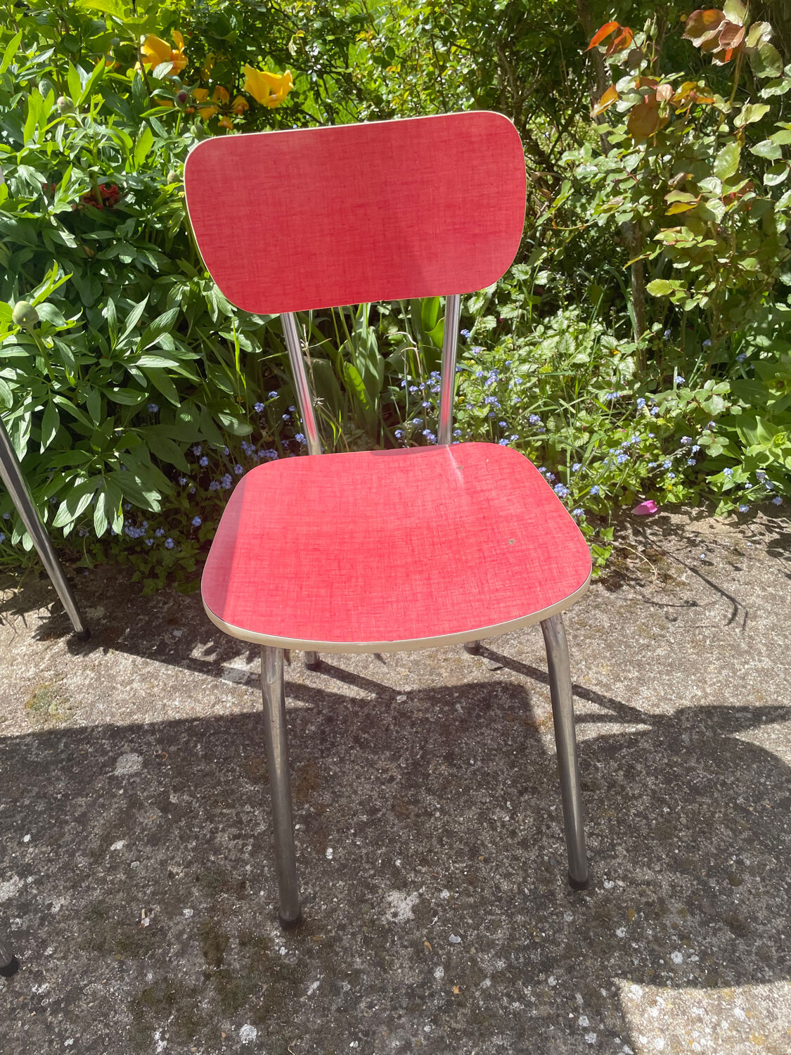 Formica table with a red Mid-century chair.