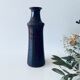Tubular vase in glazed brown sandstone