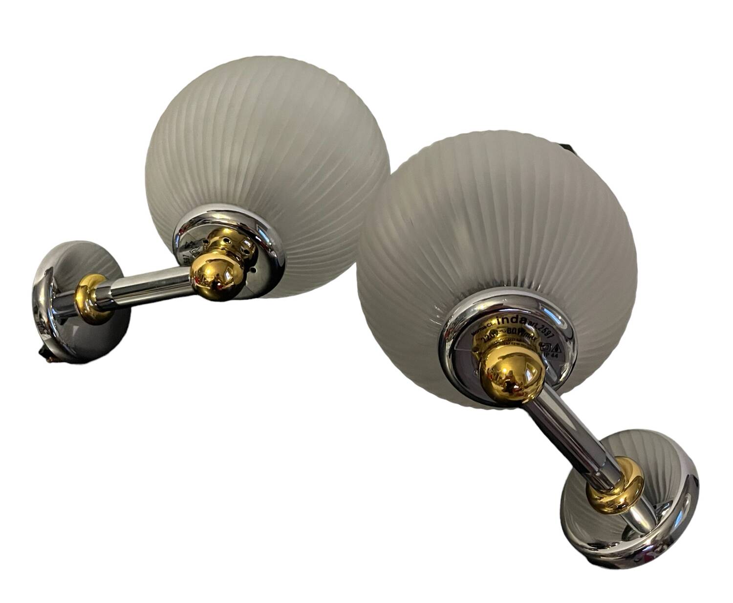 Pair of Inda metal and chiseled glass wall lights