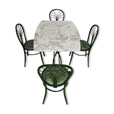 Table à manger en marbre, pieds fonte verts et 4 chaises tube acier assorties revêtement simili cuir