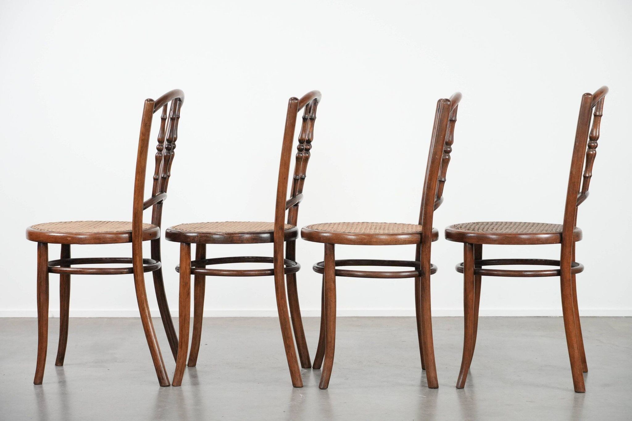 Set of 4 vintage bistro chairs Jacob & Josef Kohn Wien with a wicker seat