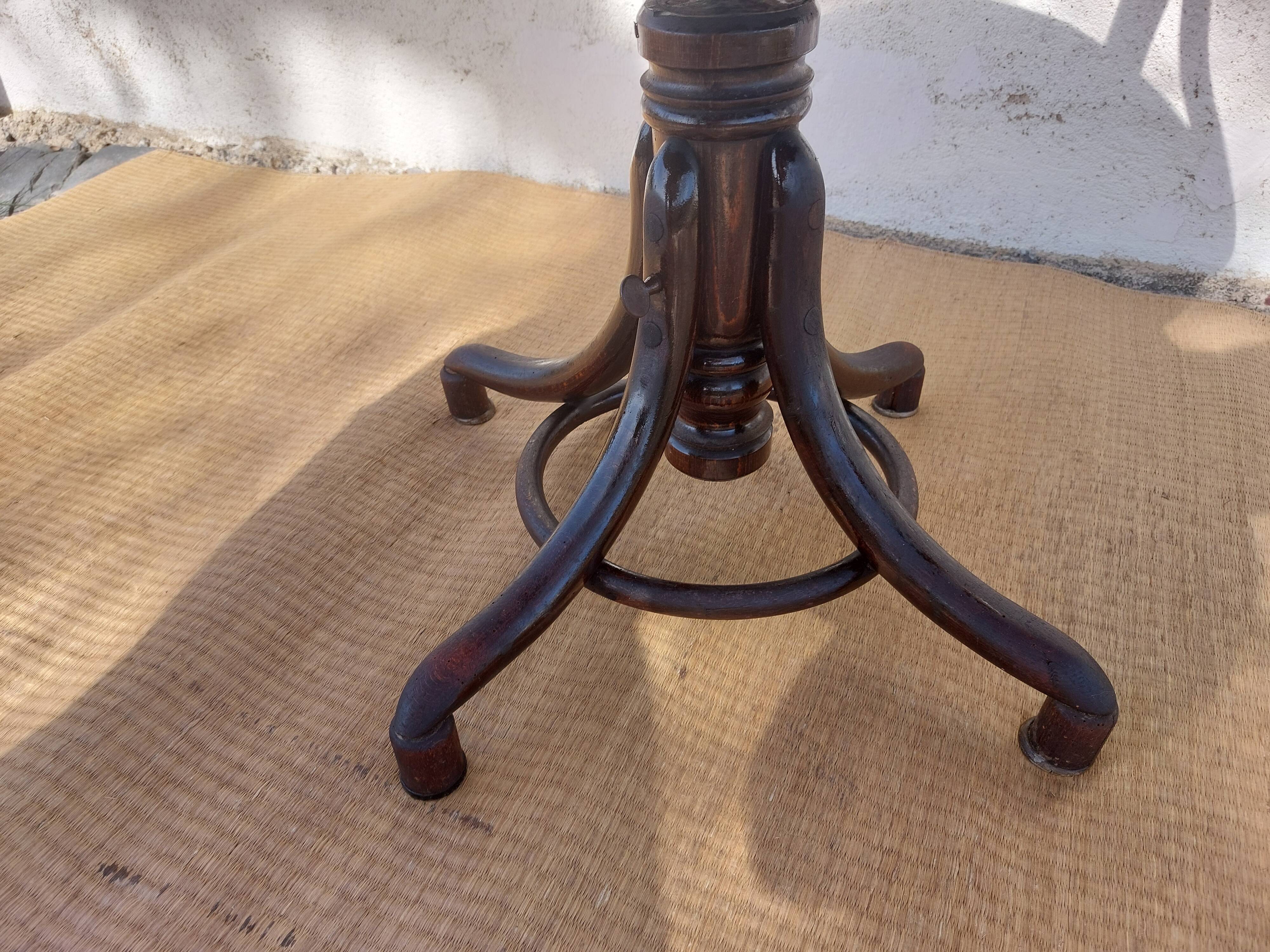 Swivel wooden armchair, pattern on seat
