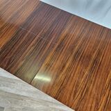 Extendable table in laminate