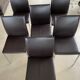 Brown leather chairs and Zanotta metal legs