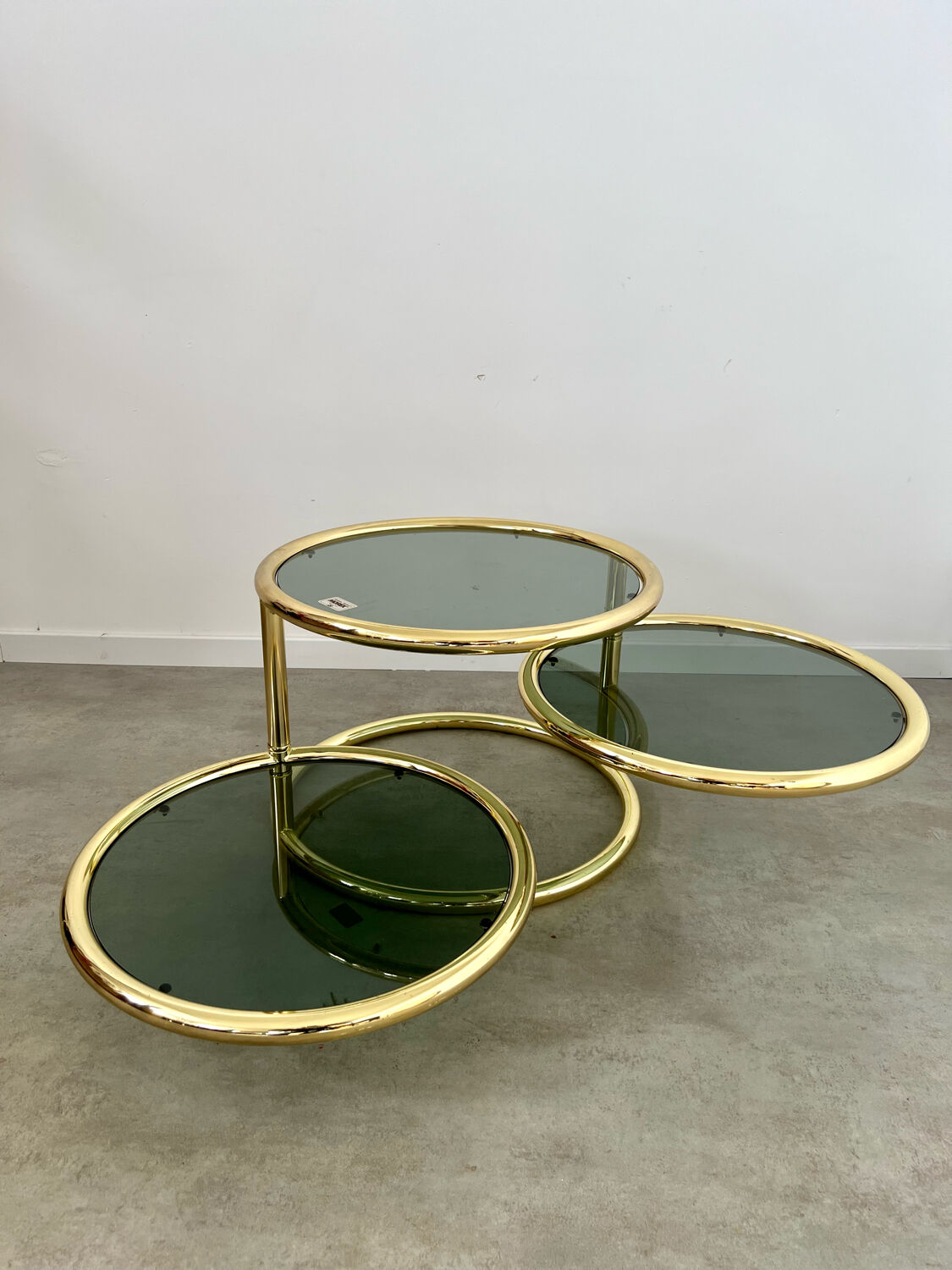 Three-level swivel coffee table in morex design brass Milo Baughman italy