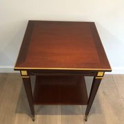 Two-level table in mahogany and brass