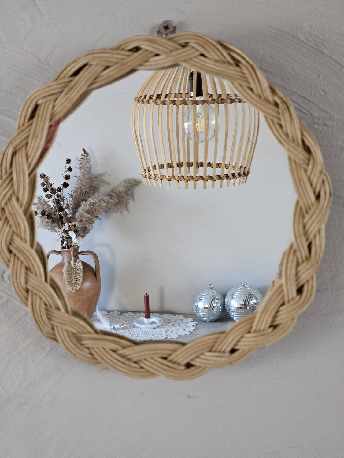 Old small round wicker mirror