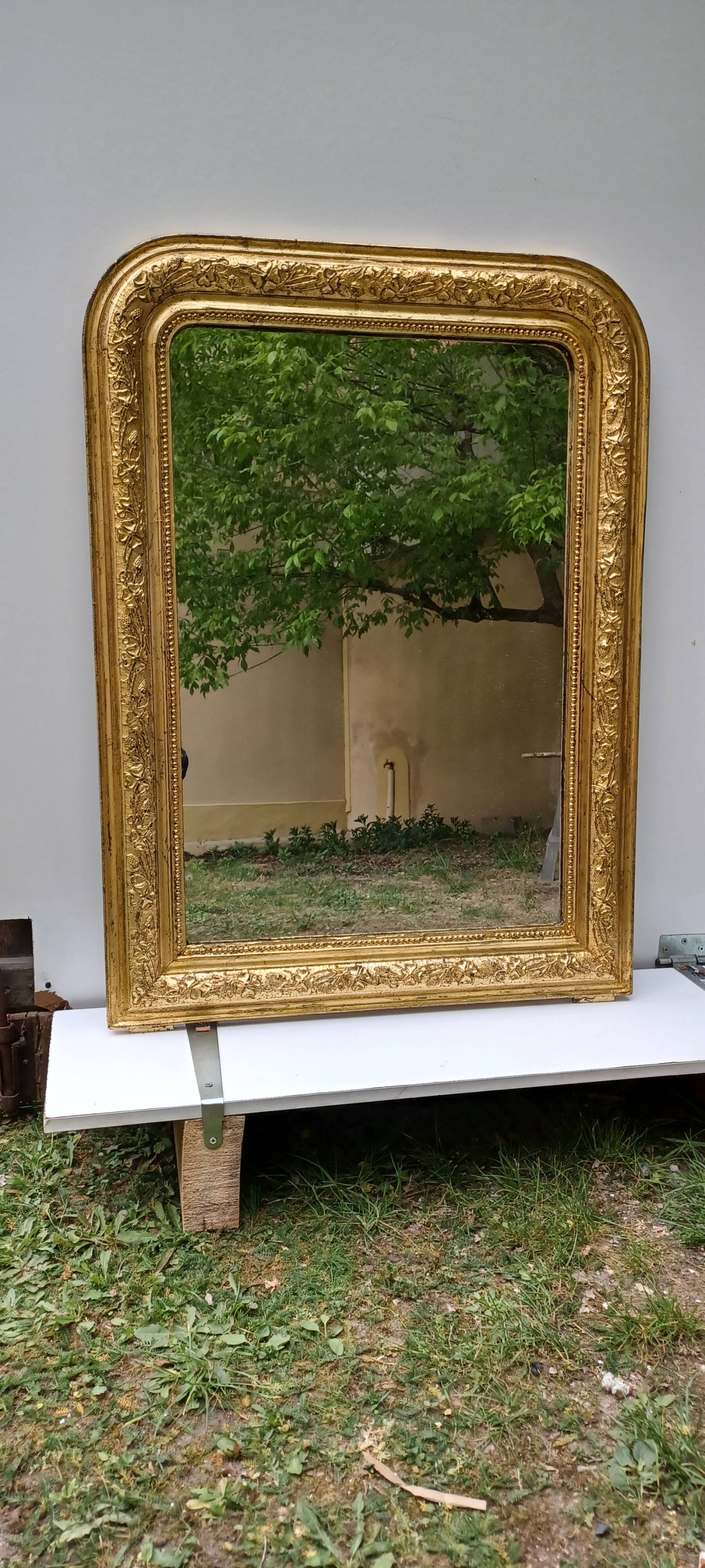 Golden mirror in louis-philippe style around 1870