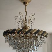 Crystal and brass chandelier with a cascade of pendants.