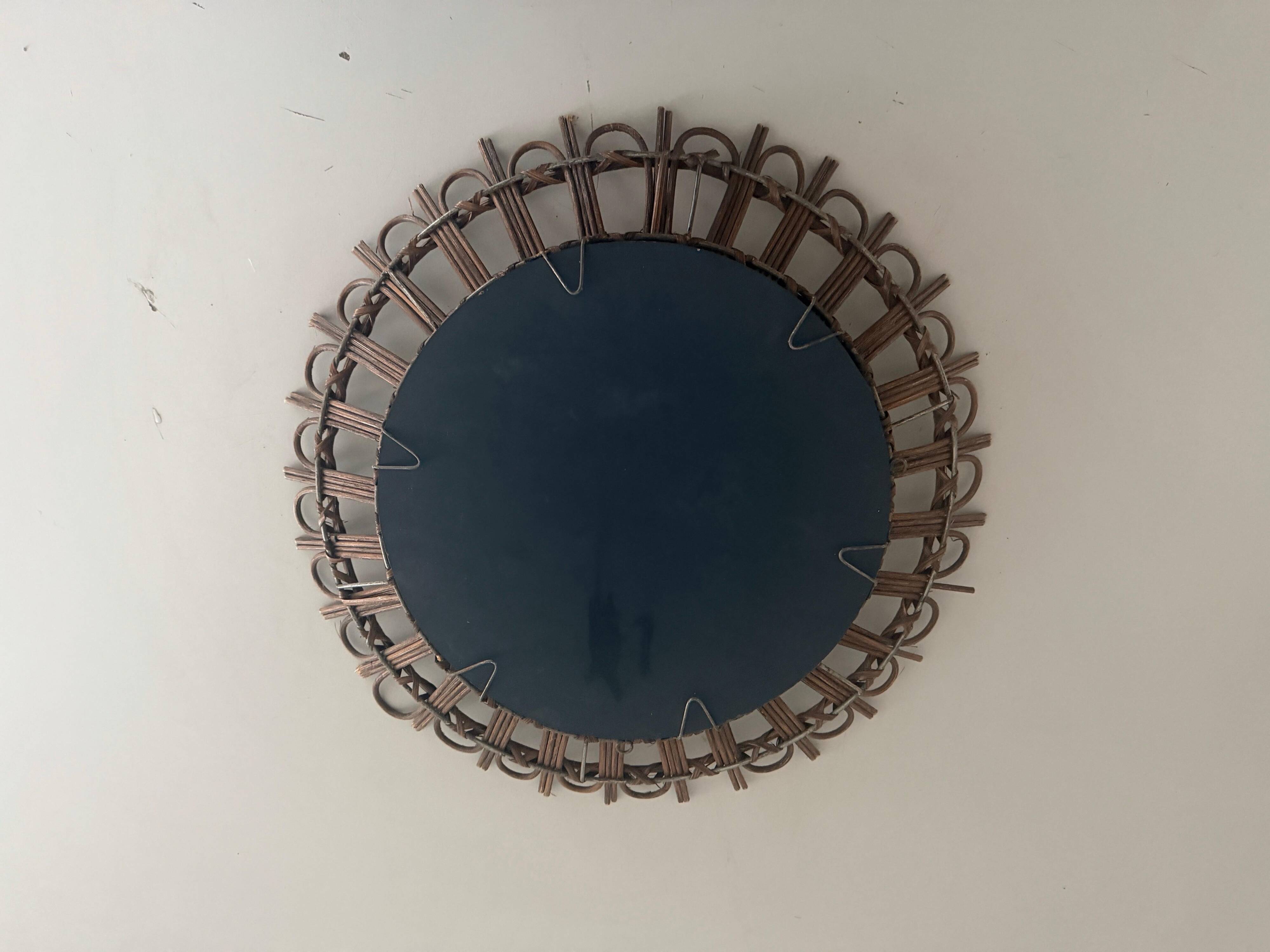 Round wall mirror with a modern mid-century wooden frame, 1960s, Germany.