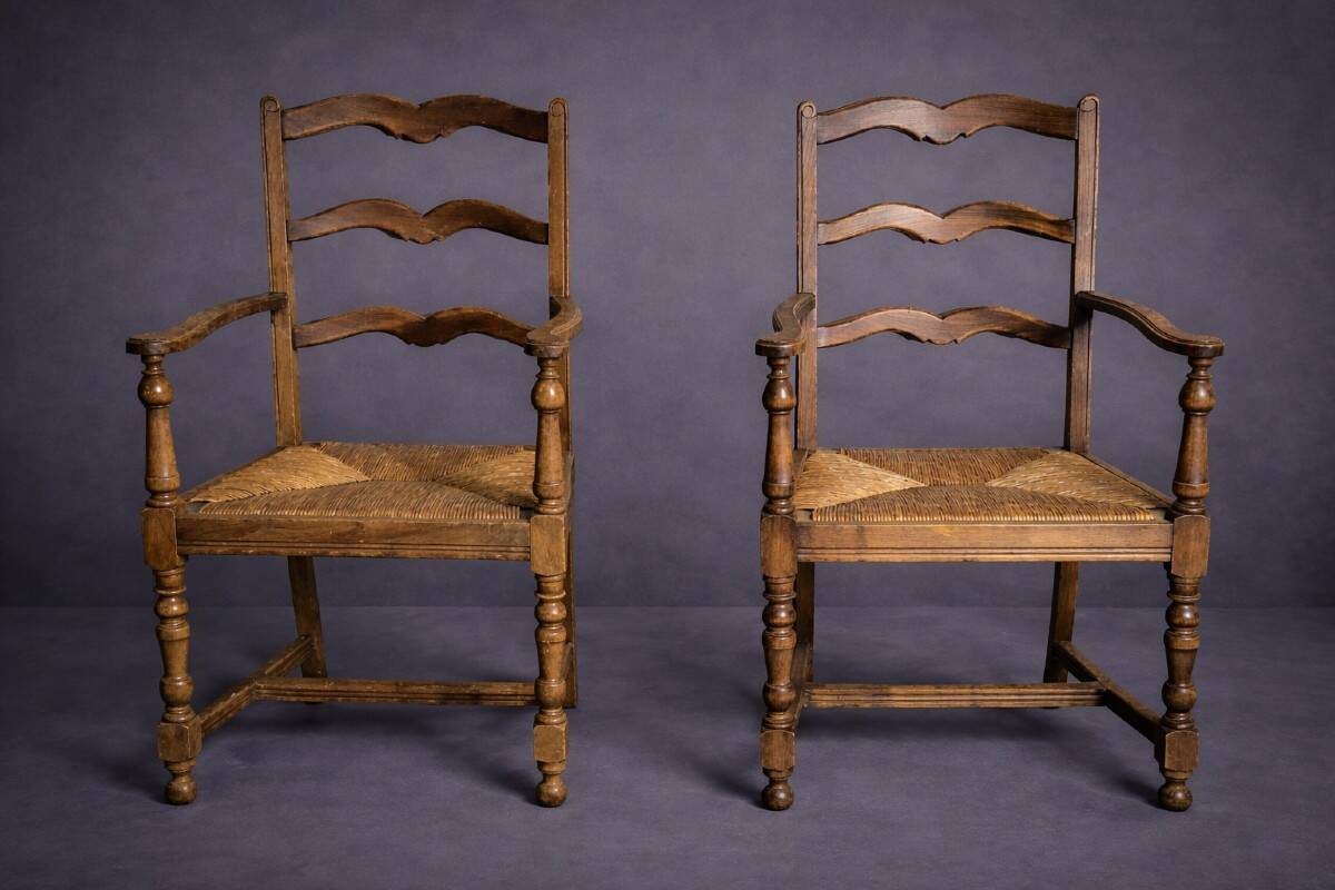 Pair of rustic antique armchairs in wood and woven straw.