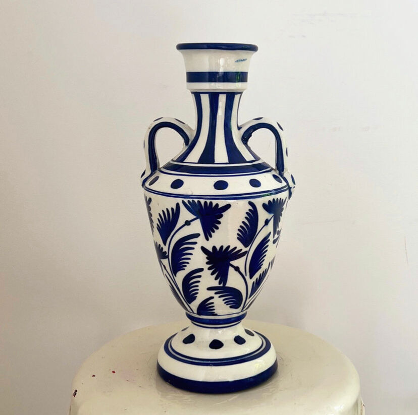 white amphora-style vase with hand-painted blue patterns