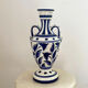white amphora-style vase with hand-painted blue patterns